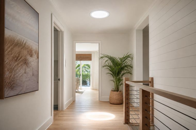 Daylight through a solar tube into a bright Florida hallway.